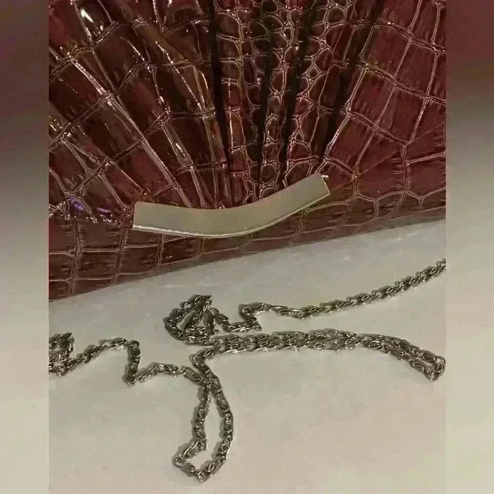 A Bijoux Turner burgandy clutch / crossbody bag.